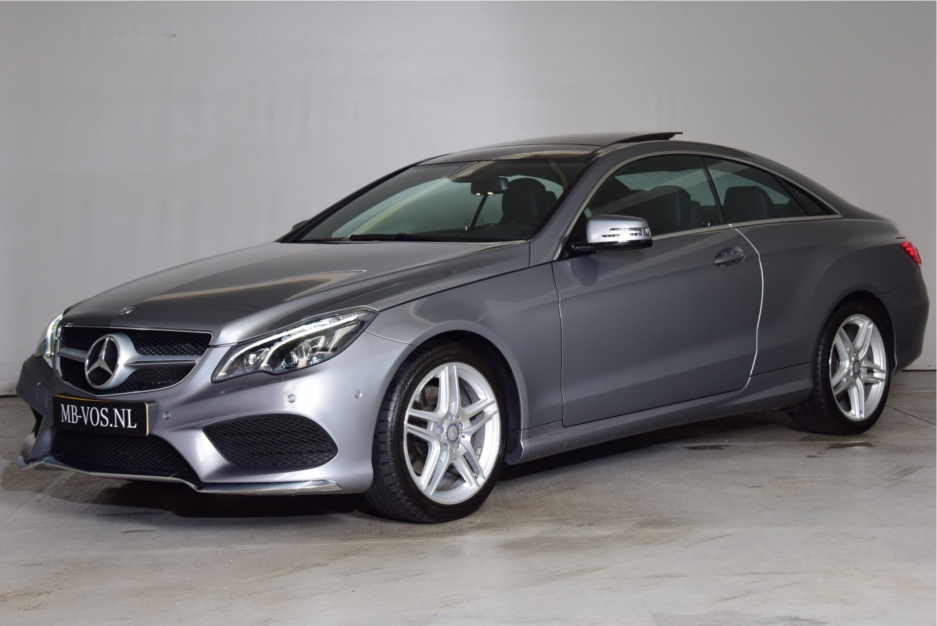 Mercedes-Benz E-Klasse Coupé 200 AMG Panorama/Com/Camera/ILS Aut7 Foto 1